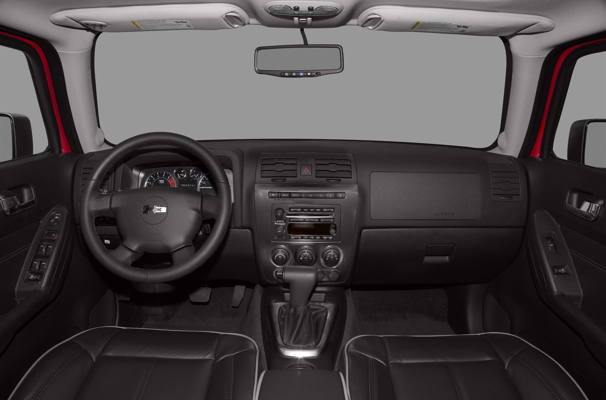 Dashboard, steering wheel, center console, and door panels interior view