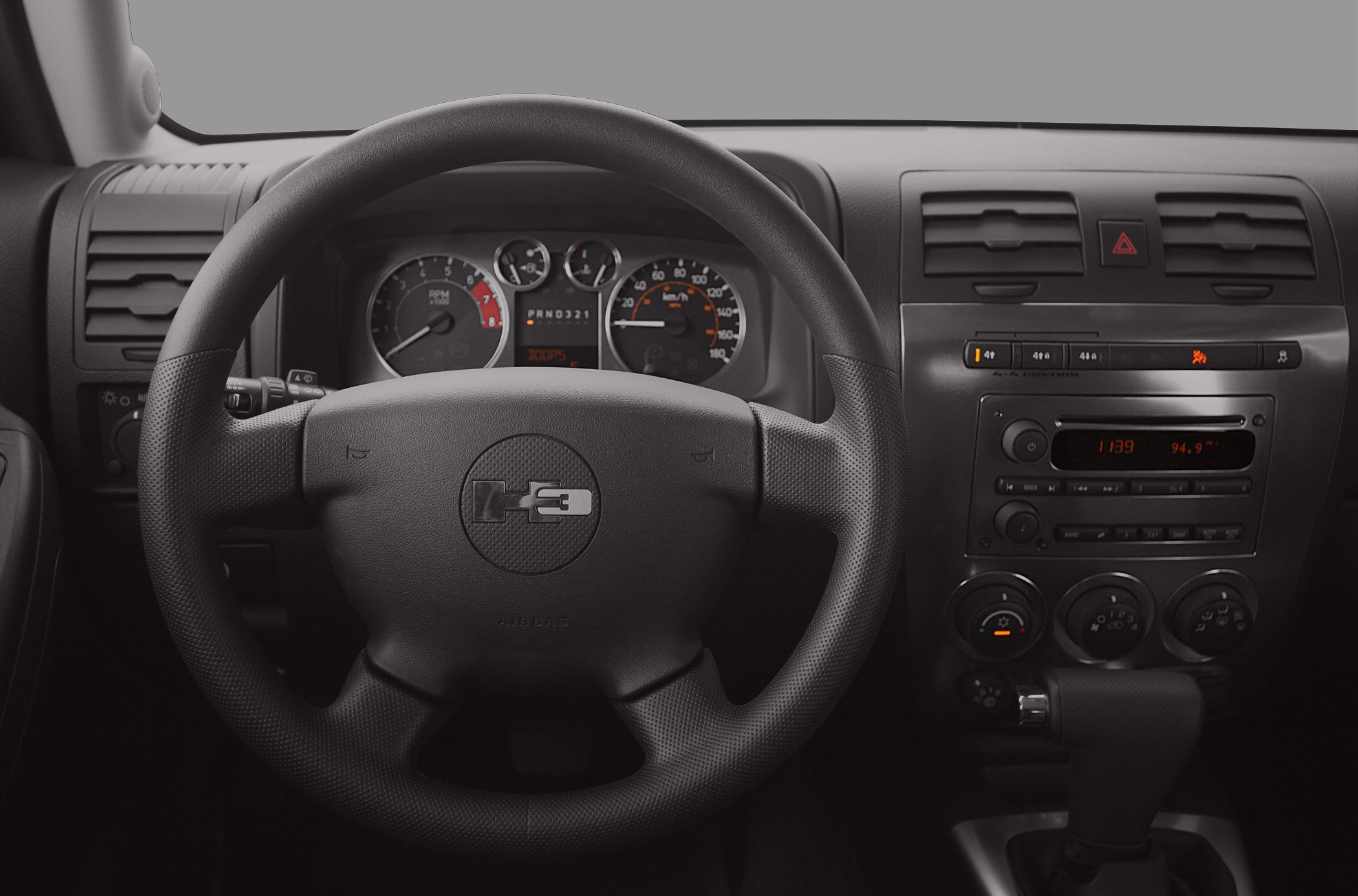 Steering wheel, gauge cluster, and center console interior view