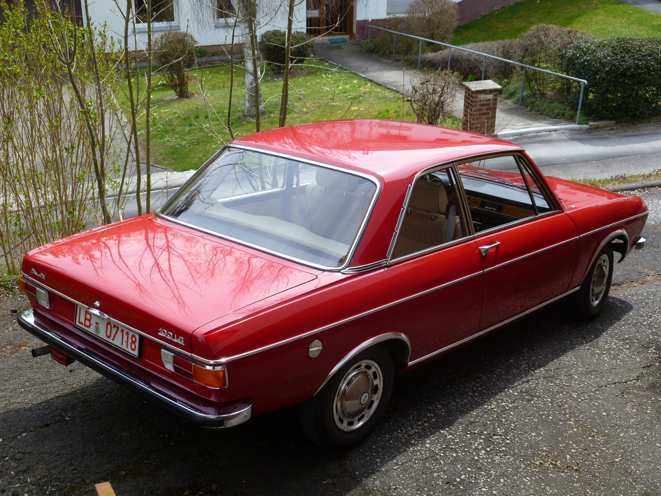 Rear and side view of a classic 1968 two-door sedan with chrome trim.
