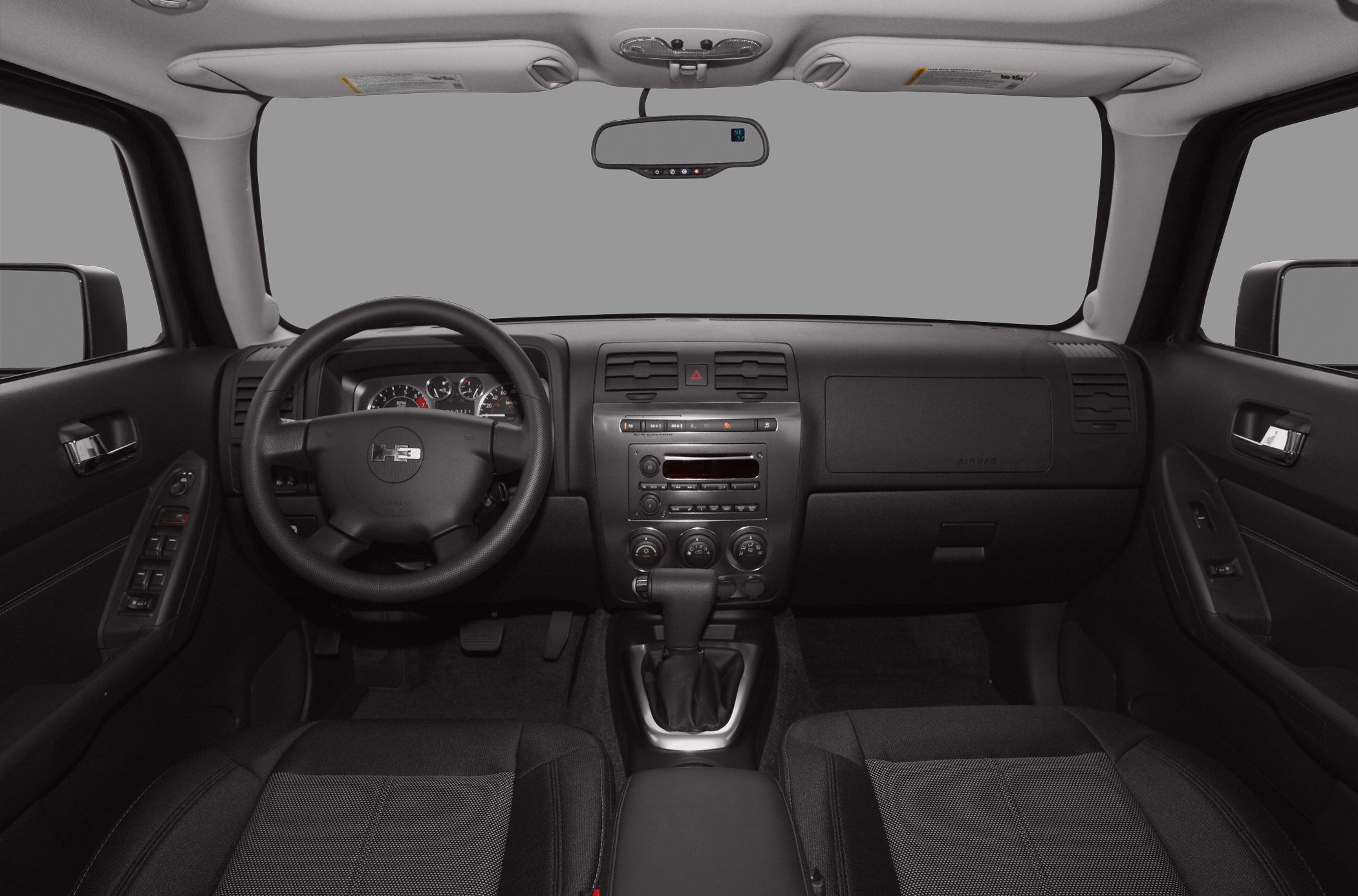 Dashboard with instrument cluster, steering wheel, and center console controls