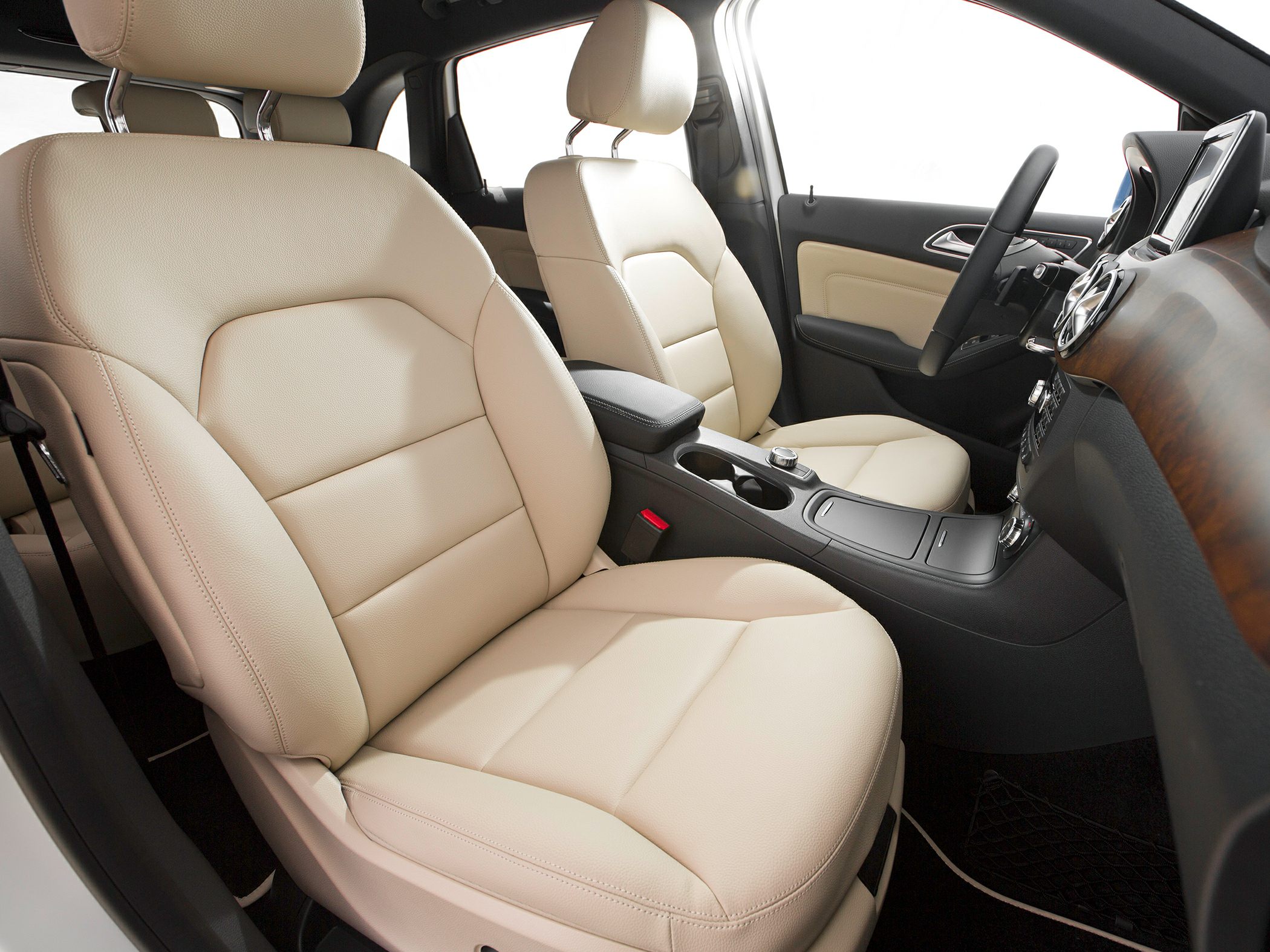 Beige leather front seats and modern dashboard interior