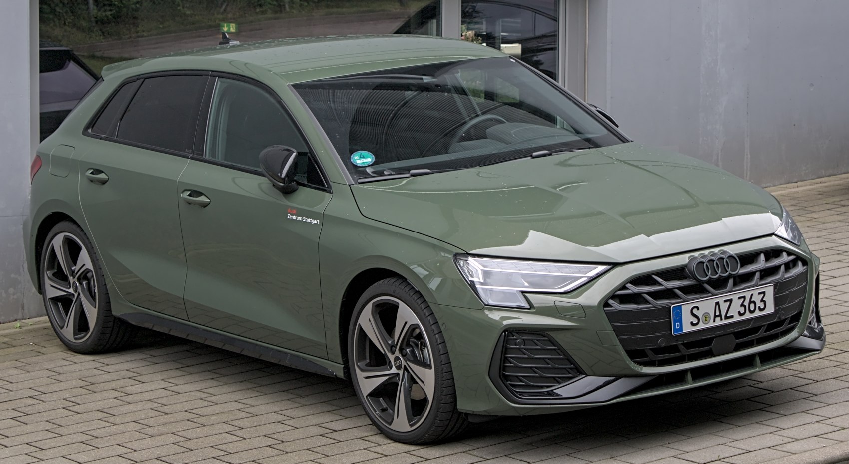 Front and side view of a modern hatchback with sleek headlights and distinctive grille