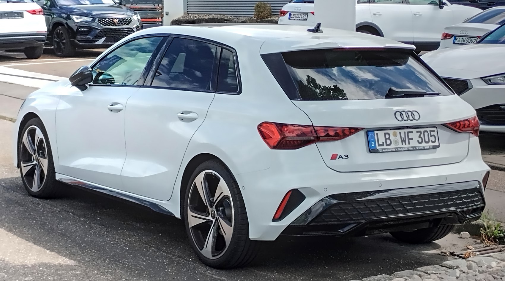 Rear view of modern hatchback with distinct taillights and alloy wheels