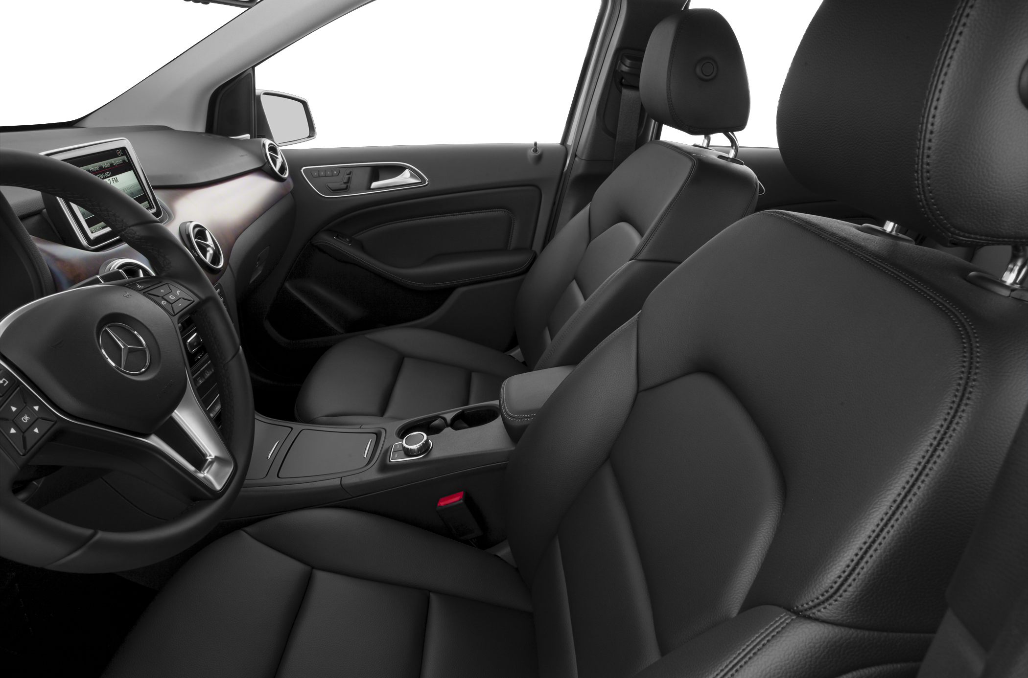 Black leather front seats and dashboard with infotainment system
