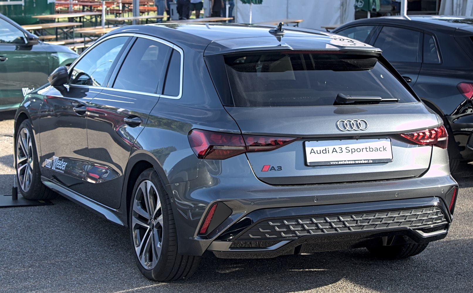 Rear view of a modern hatchback with distinctive LED taillights and sporty bumper design