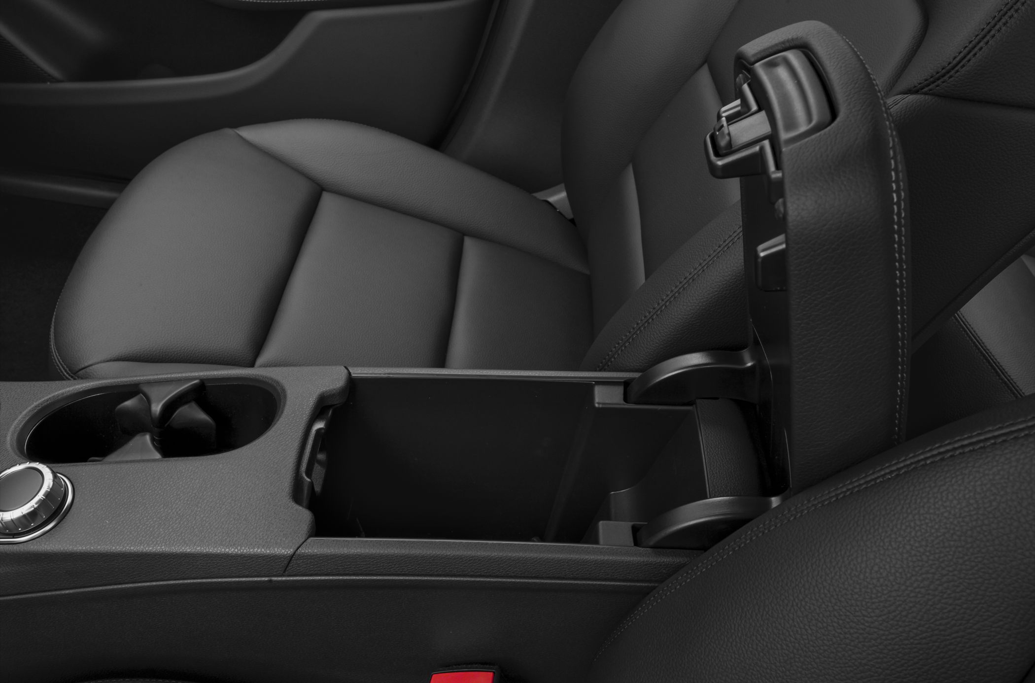 Black leather center console and armrest with cup holder