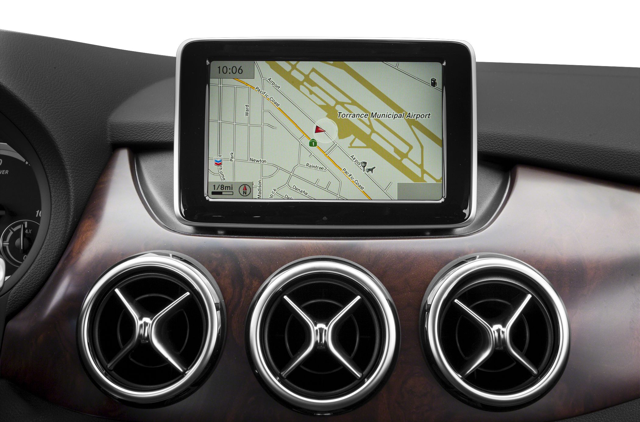 Dashboard navigation screen and three circular air vents with wood trim background