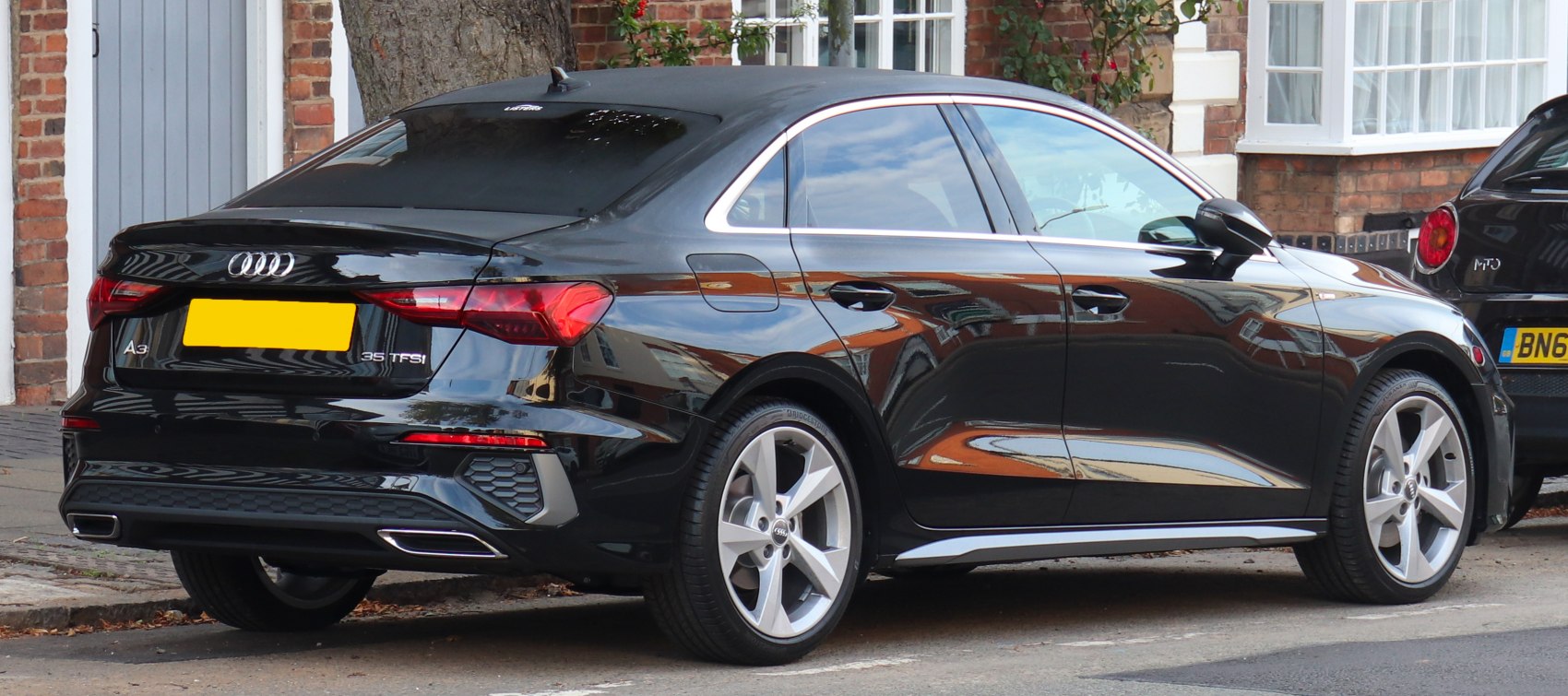 Rear and side view of black sedan with LED taillights and 35 TFSI badge