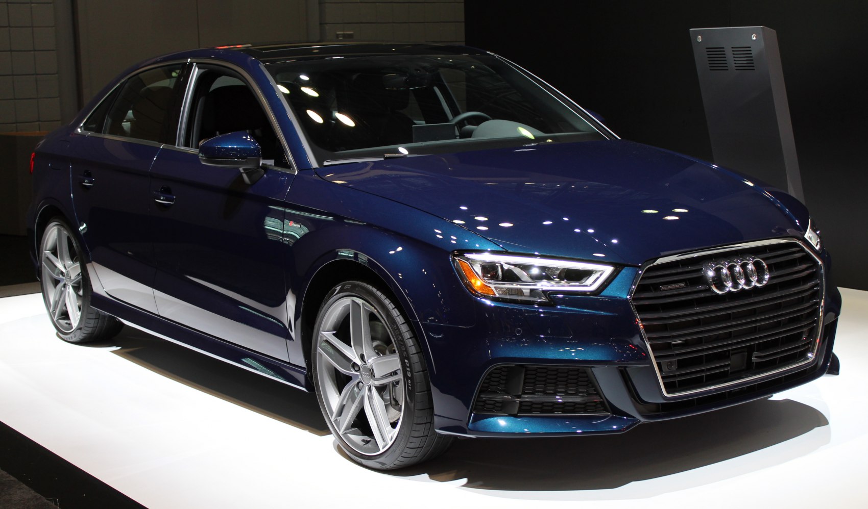 Front exterior view with LED headlights and signature grille
