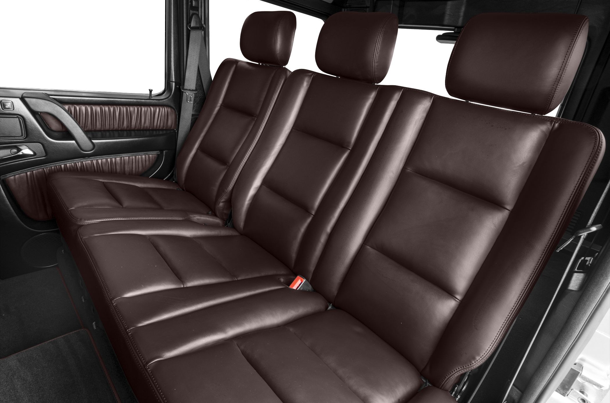 Rear seats with brown leather upholstery and headrests