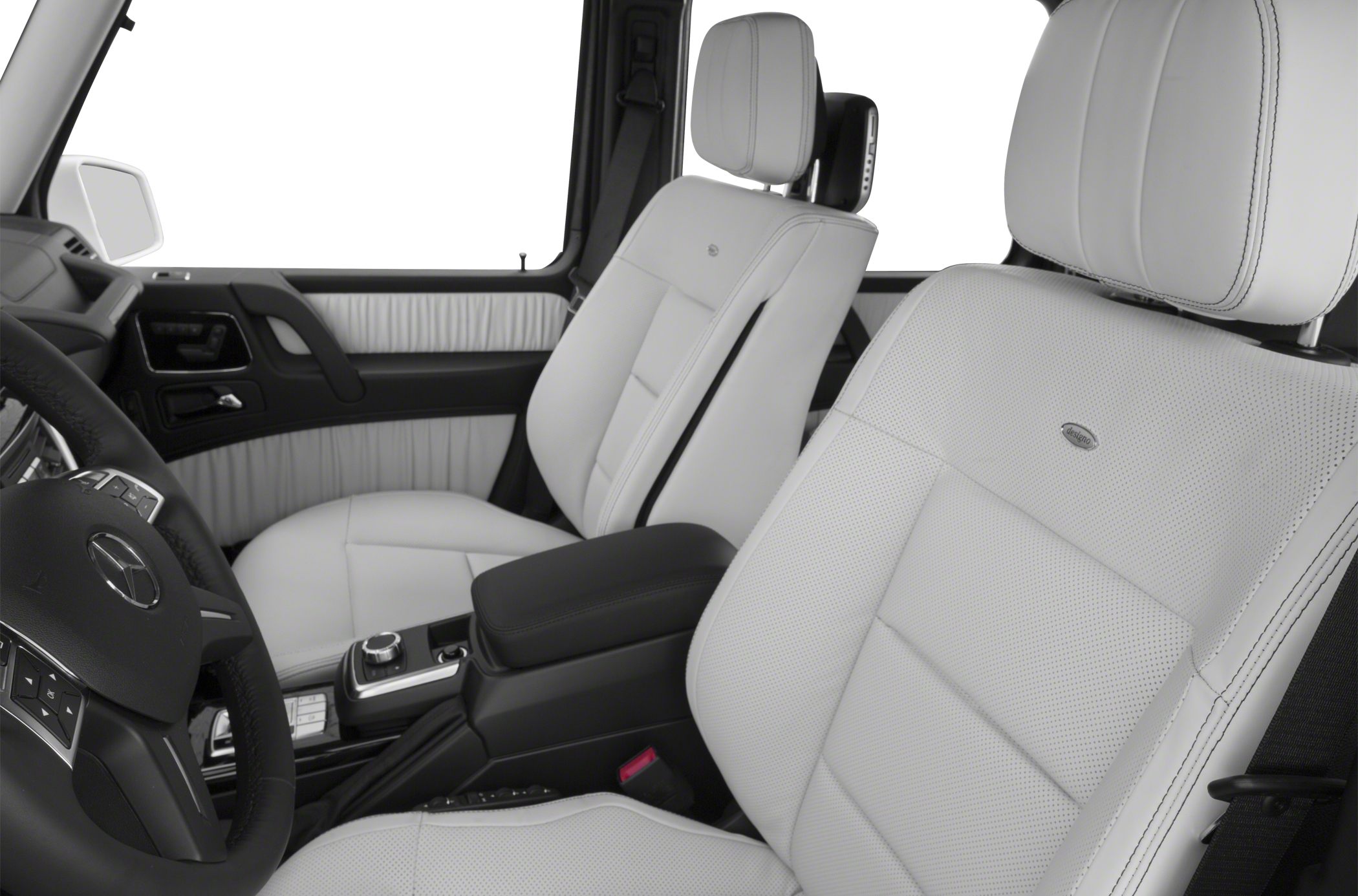 White perforated leather seats and black steering wheel inside luxury suv