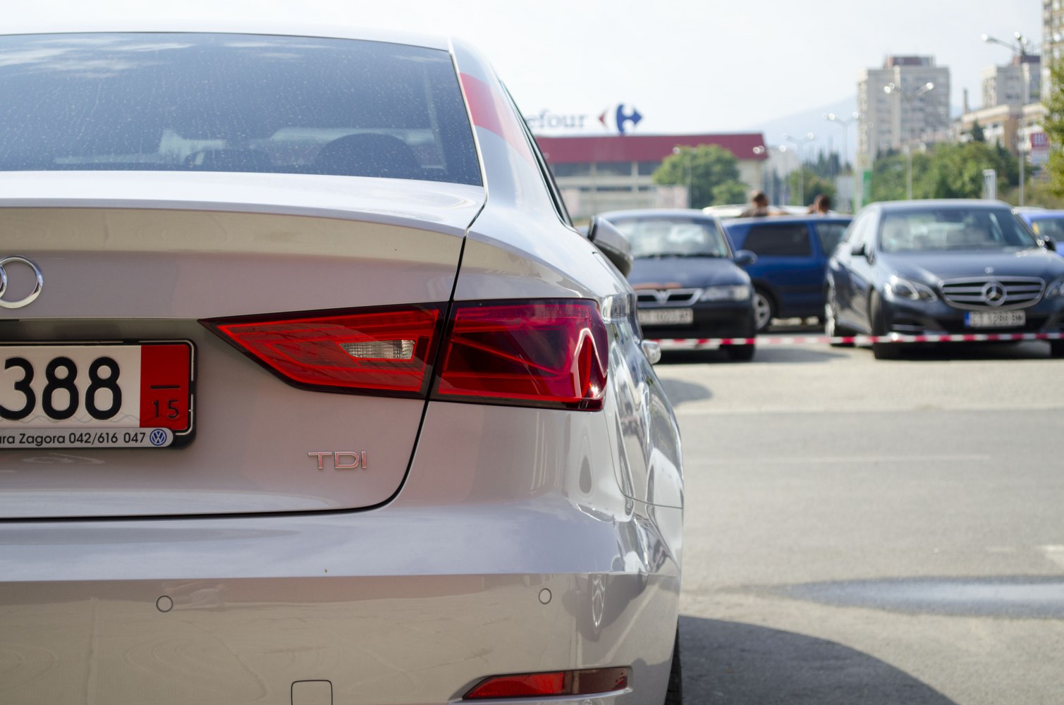 Close-up of sedan rear taillight and TDI badge