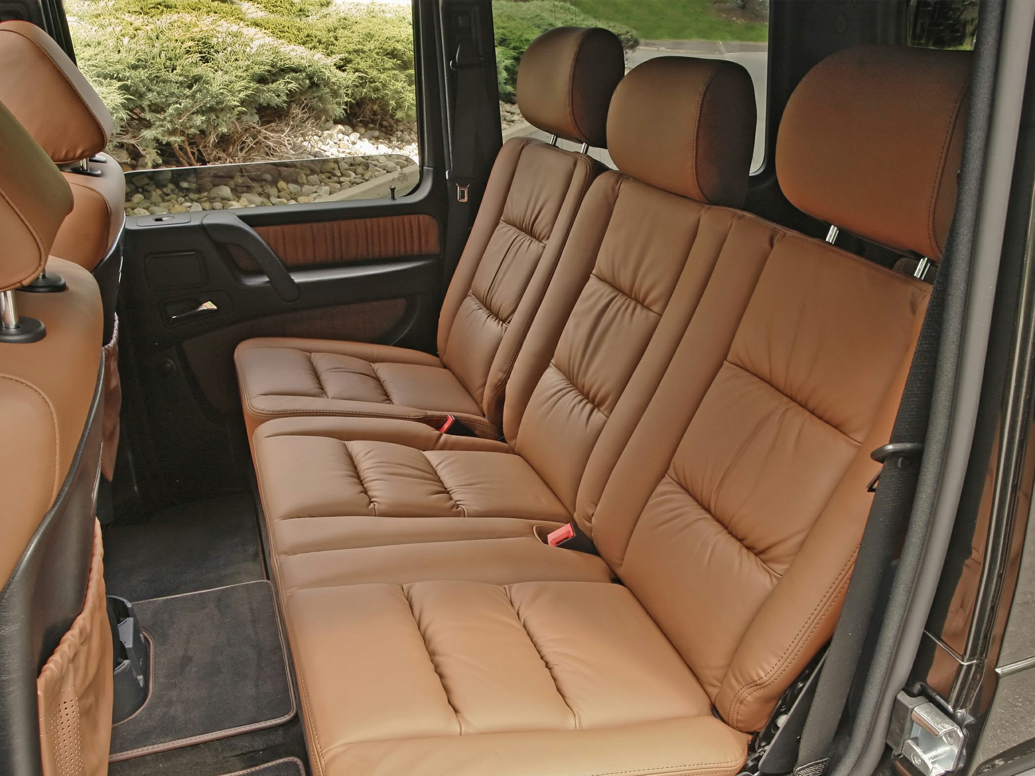 Brown leather rear seat with spacious, plush design