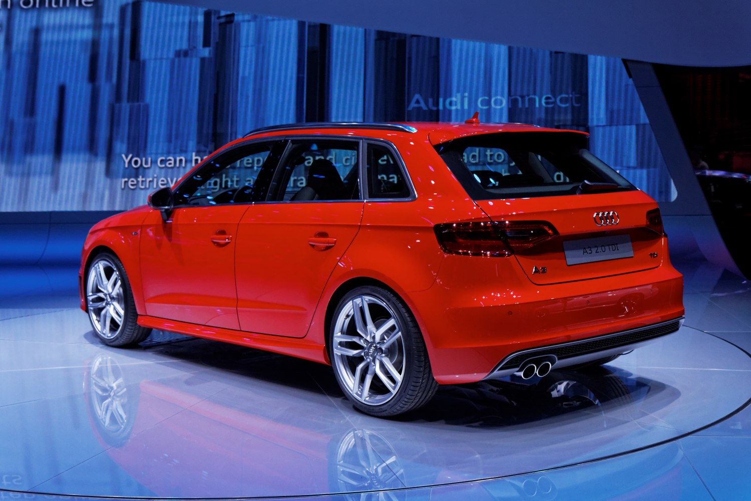 Red hatchback with sporty alloy wheels and twin exhaust pipes