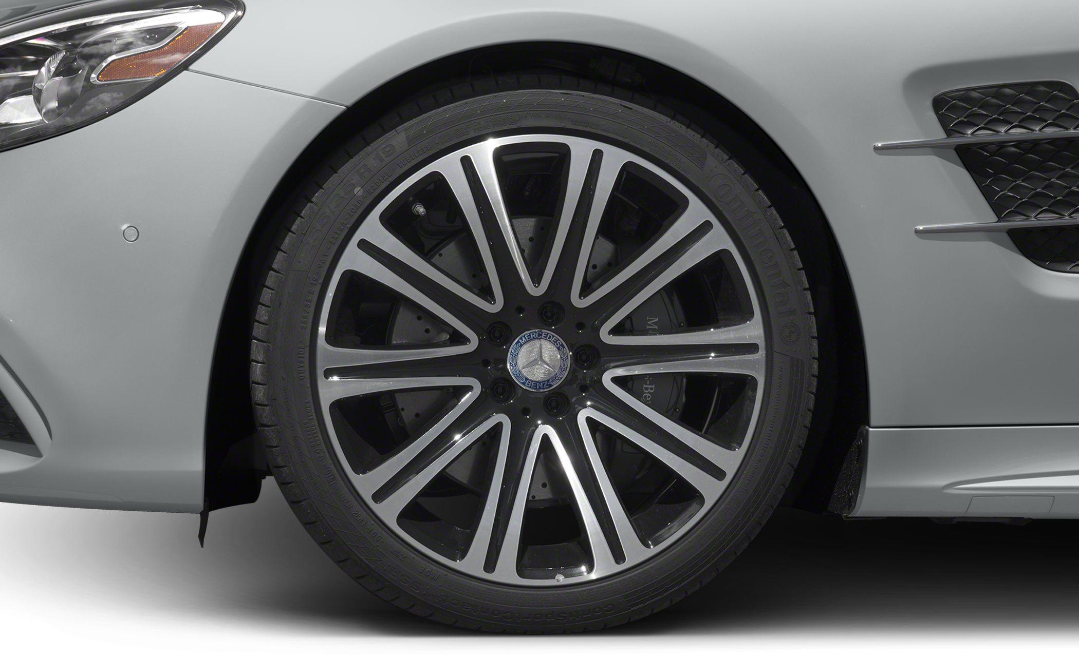 Multi-spoke alloy wheel and tire on luxury sports car