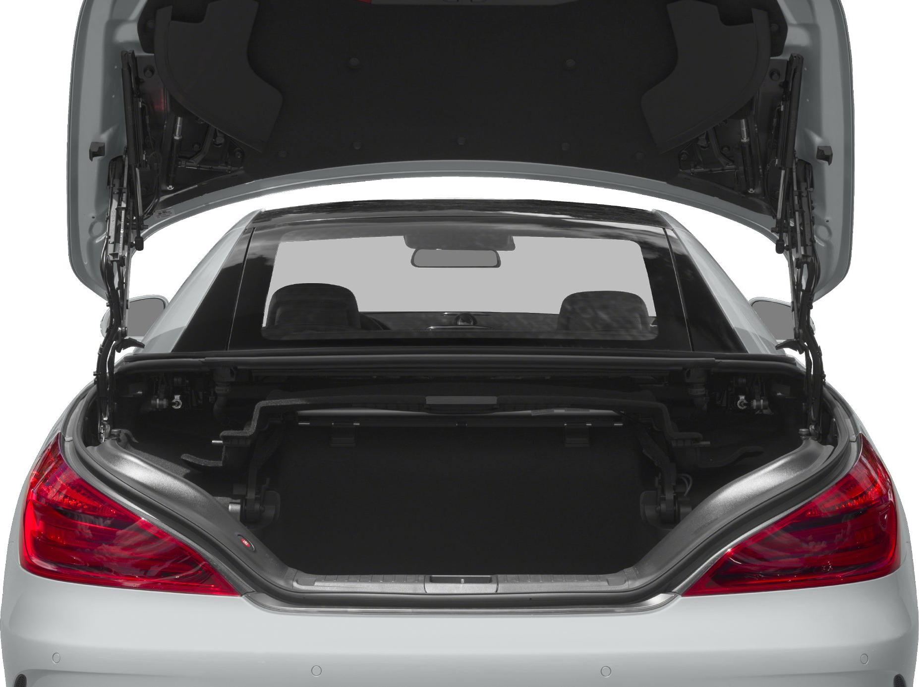 Open trunk of a luxury convertible with visible rear seats.