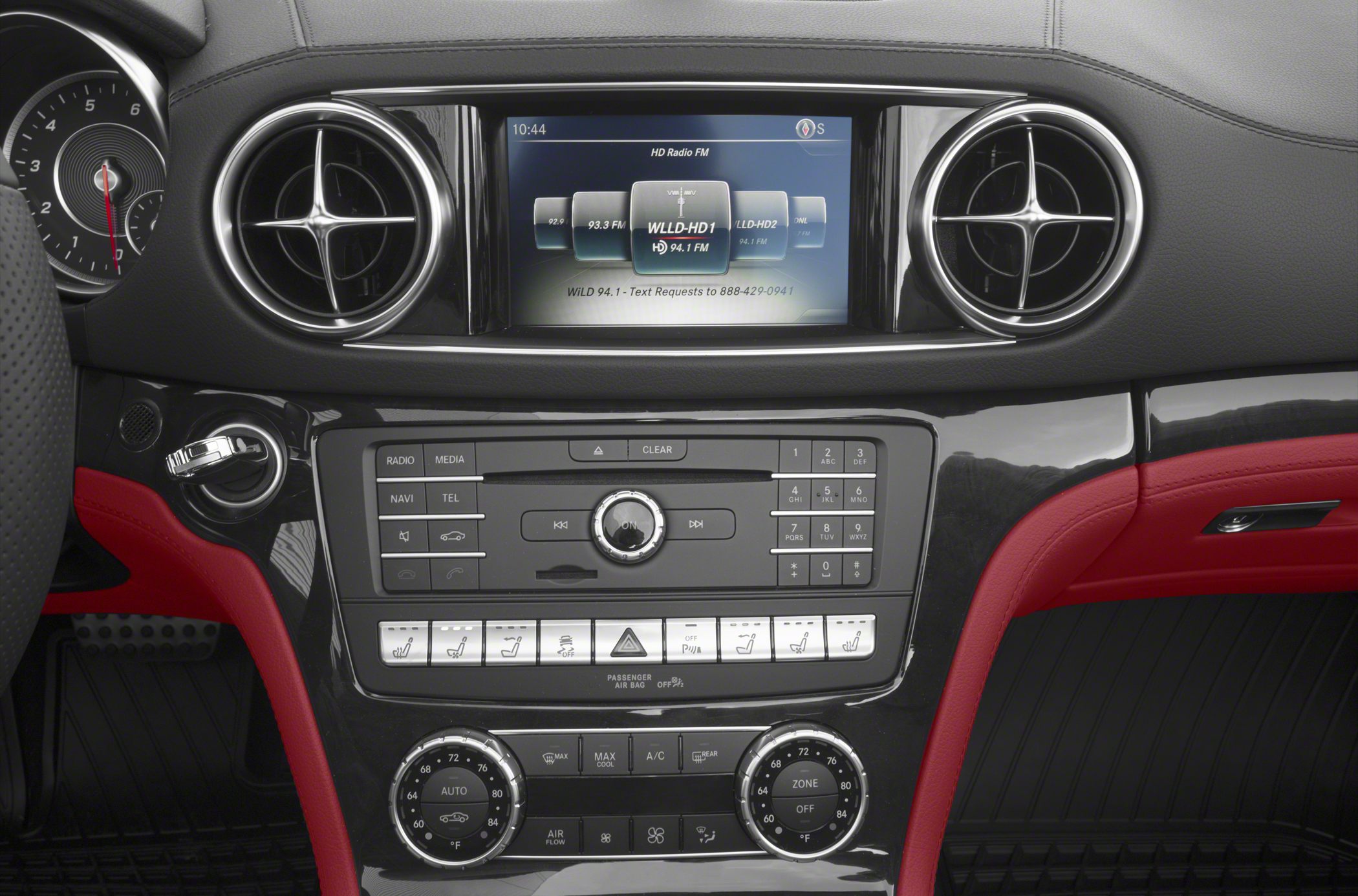 Dashboard with circular air vents and central infotainment screen