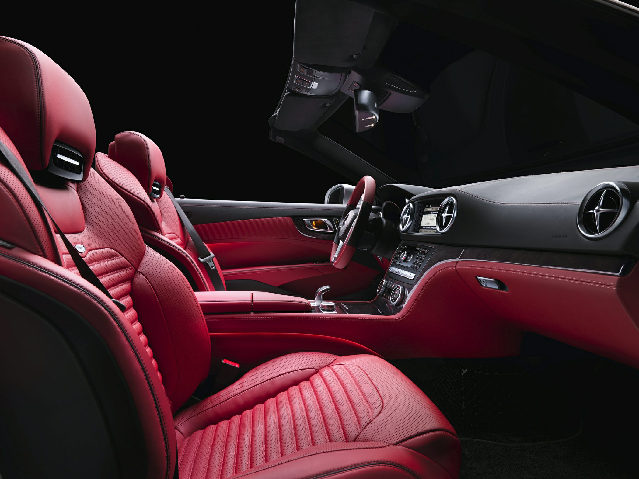 Luxury red leather seats and dashboard with modern controls