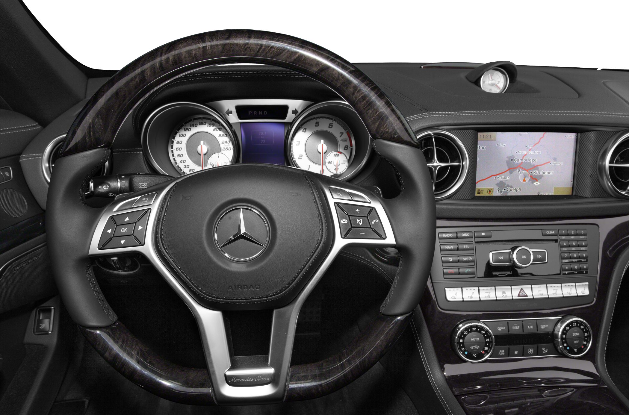 Luxury steering wheel with analog gauges and central infotainment console