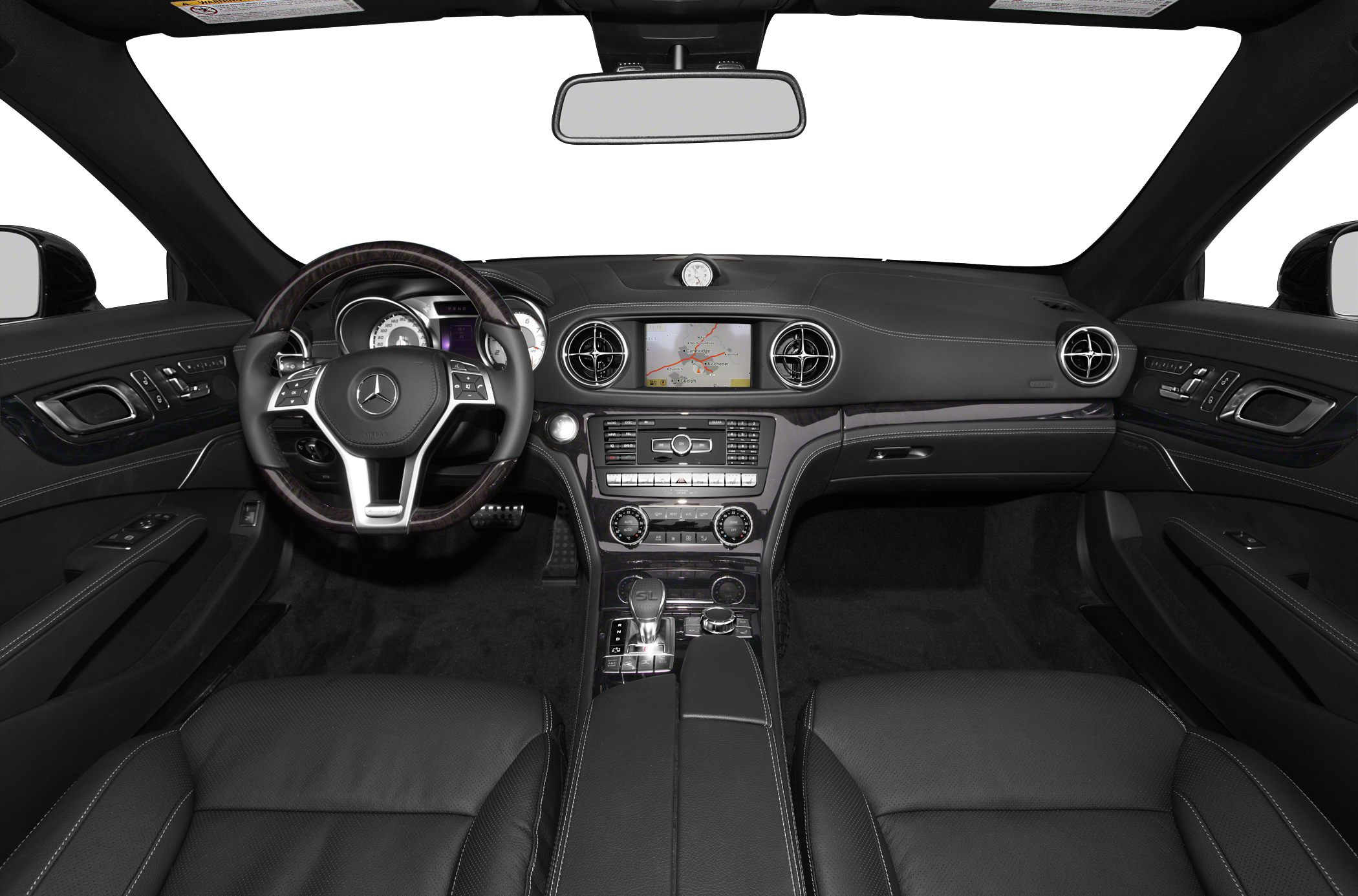 Luxury car interior with dashboard, steering wheel, and center console.