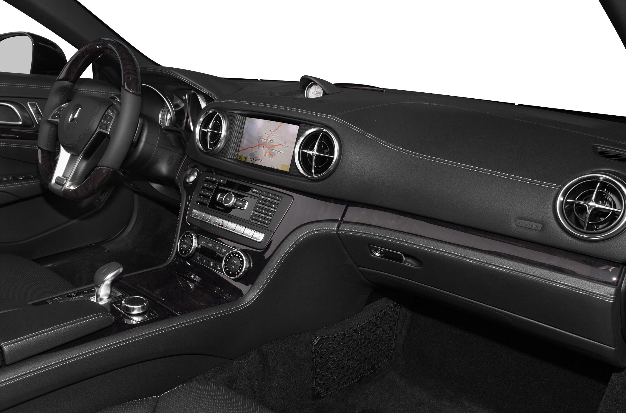 Dashboard with navigation, round air vents, steering wheel with controls