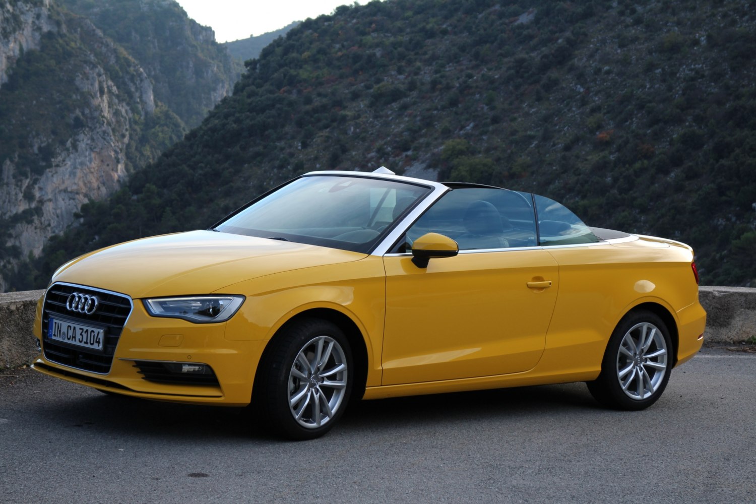 Yellow convertible with alloy wheels and modern headlights