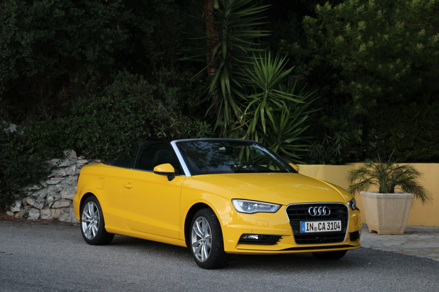 Yellow convertible with silver wheels and LED headlights