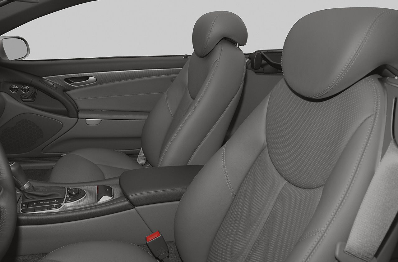 Front leather seats and center console of luxury convertible interior