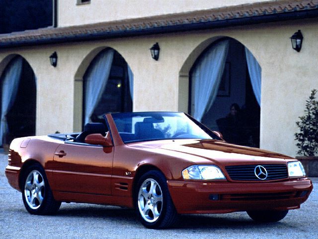 Convertible luxury roadster with distinctive alloy wheels and sleek design.