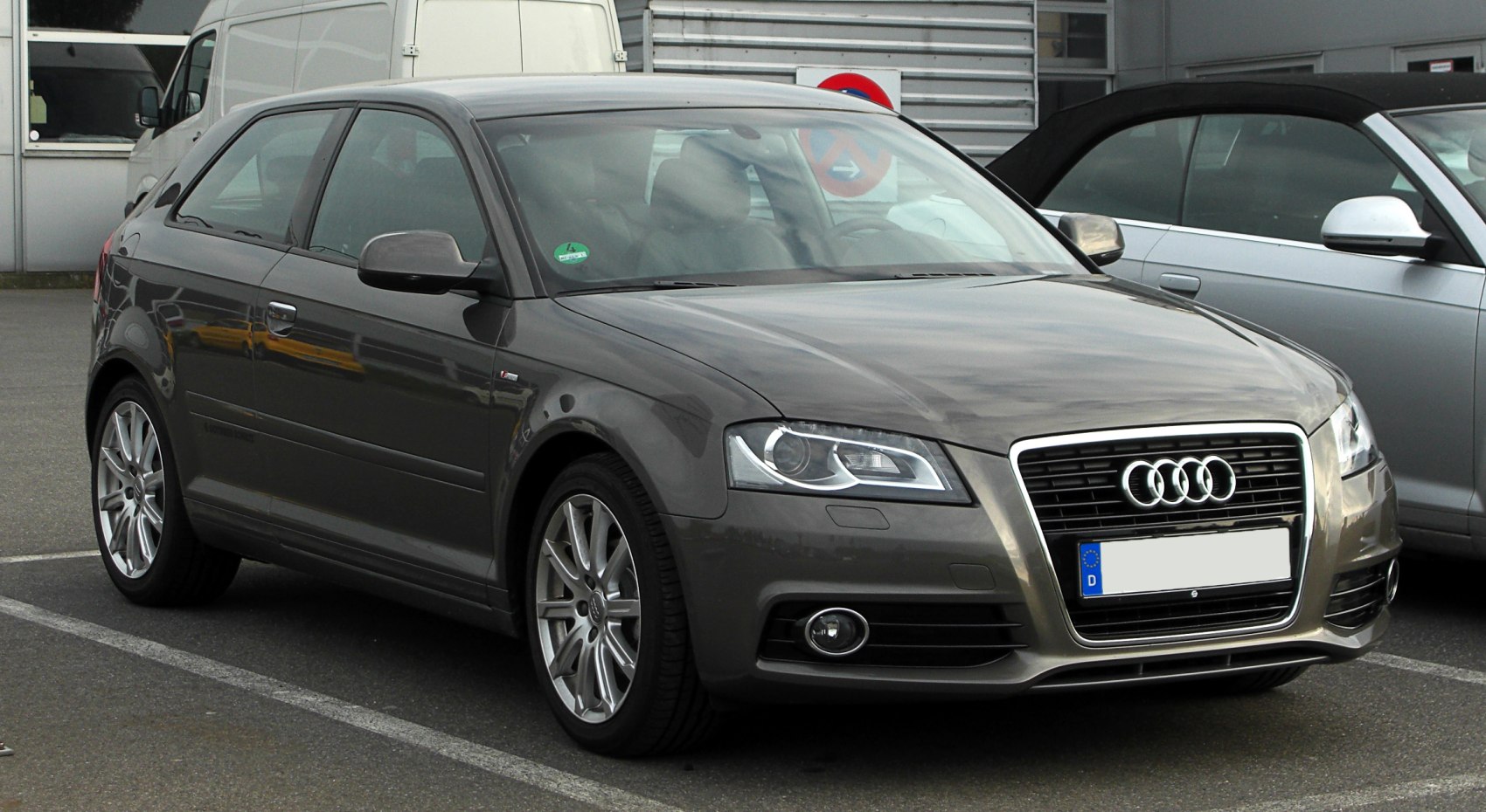 Front angled view with headlights and alloy wheels