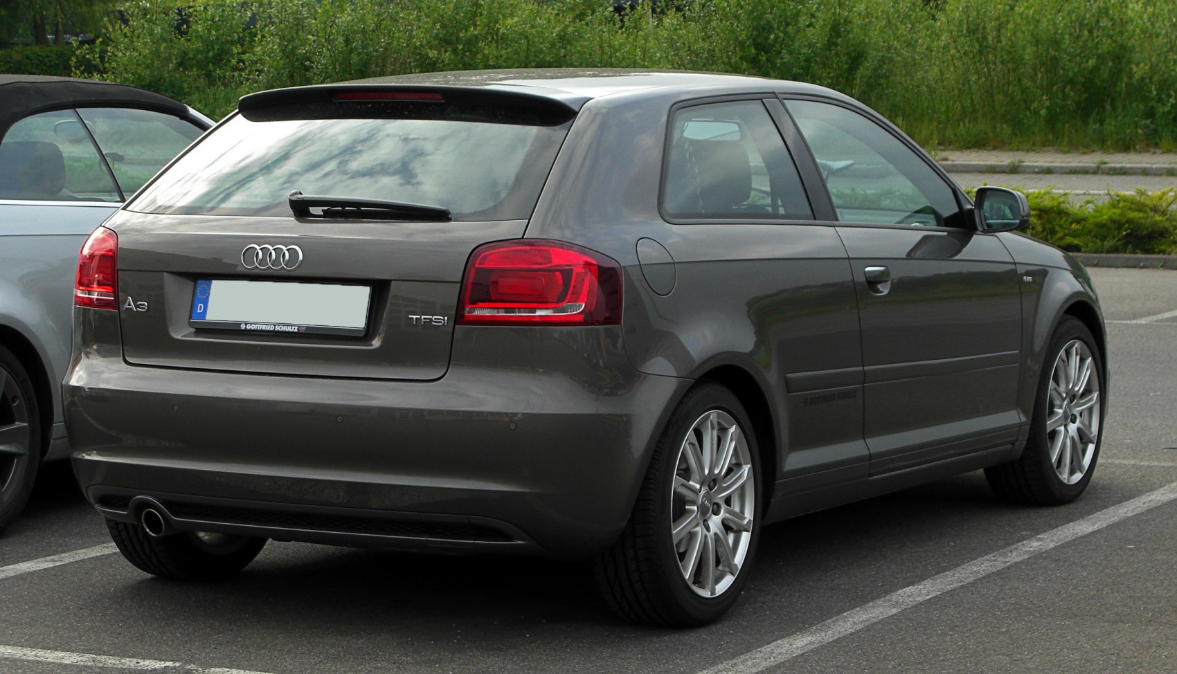 Rear view of a facelifted hatchback with distinctive taillights and rear wiper