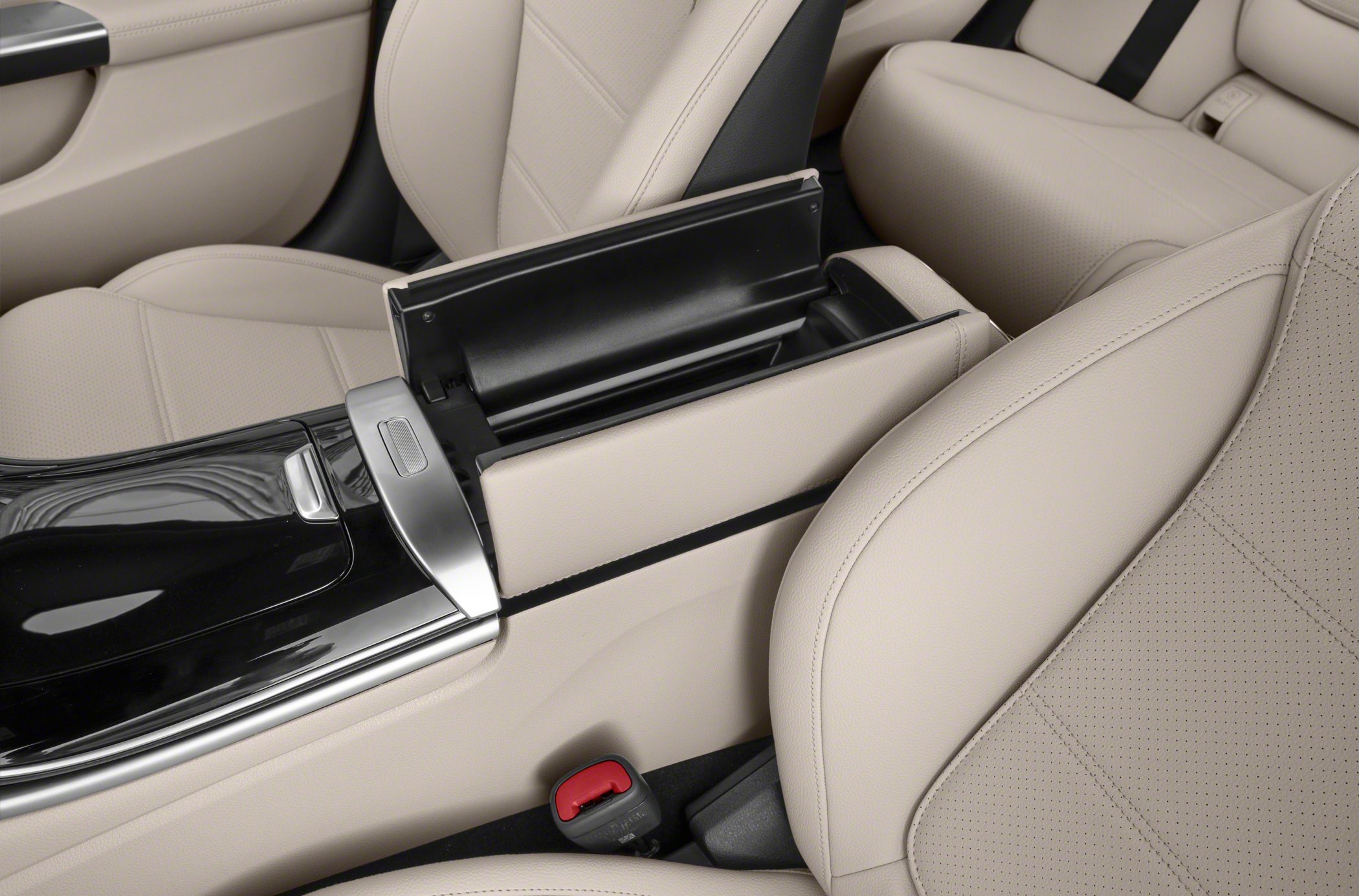 Beige leather seats and open center console storage compartment