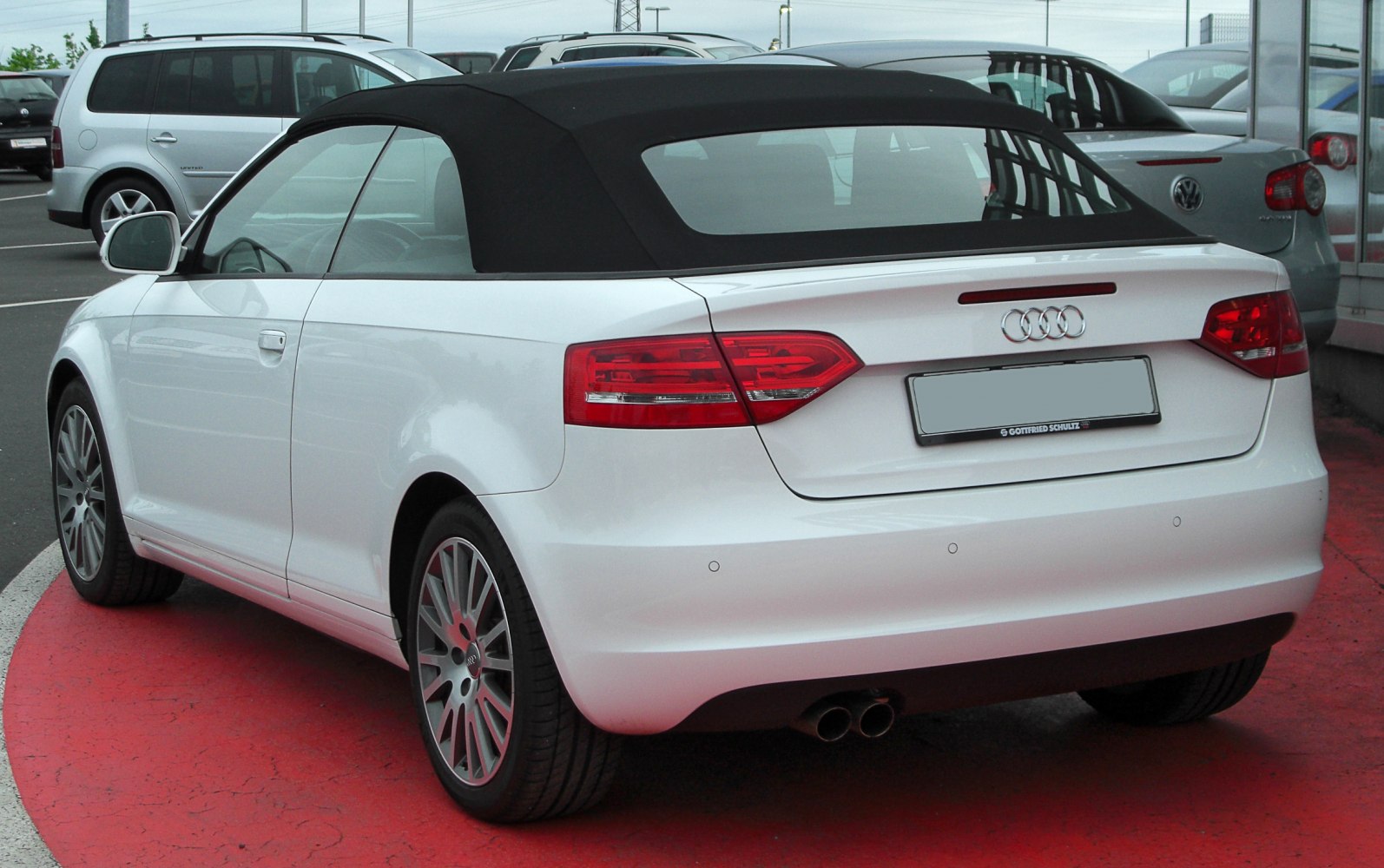 Rear view of convertible with fabric soft top and distinct taillights