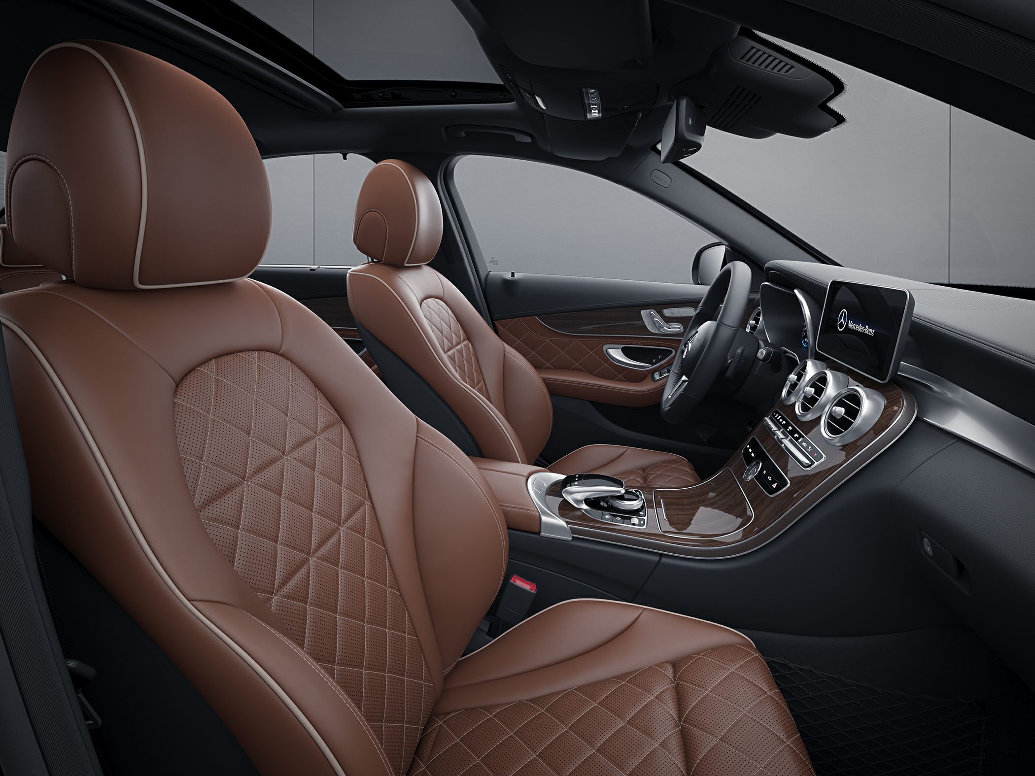 Brown quilted leather seats with wood trim dashboard and modern controls