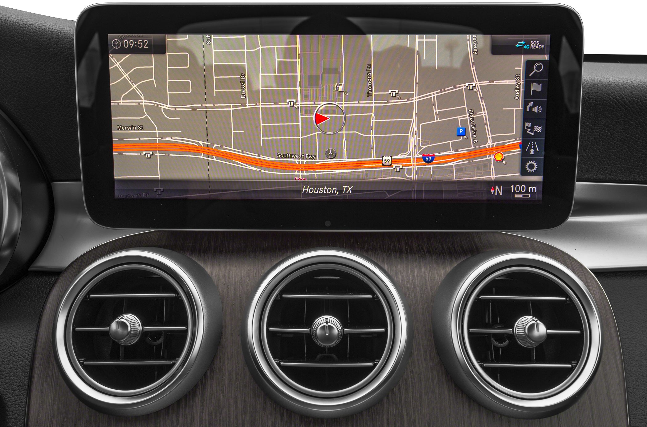 Digital navigation screen with triple circular air vents on dashboard