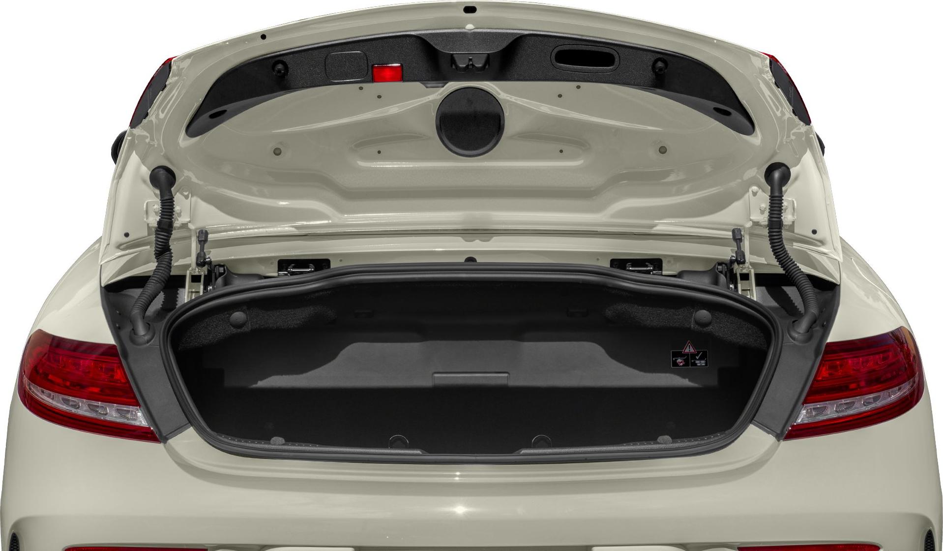 Open trunk interior with visible hinges and rear light edges