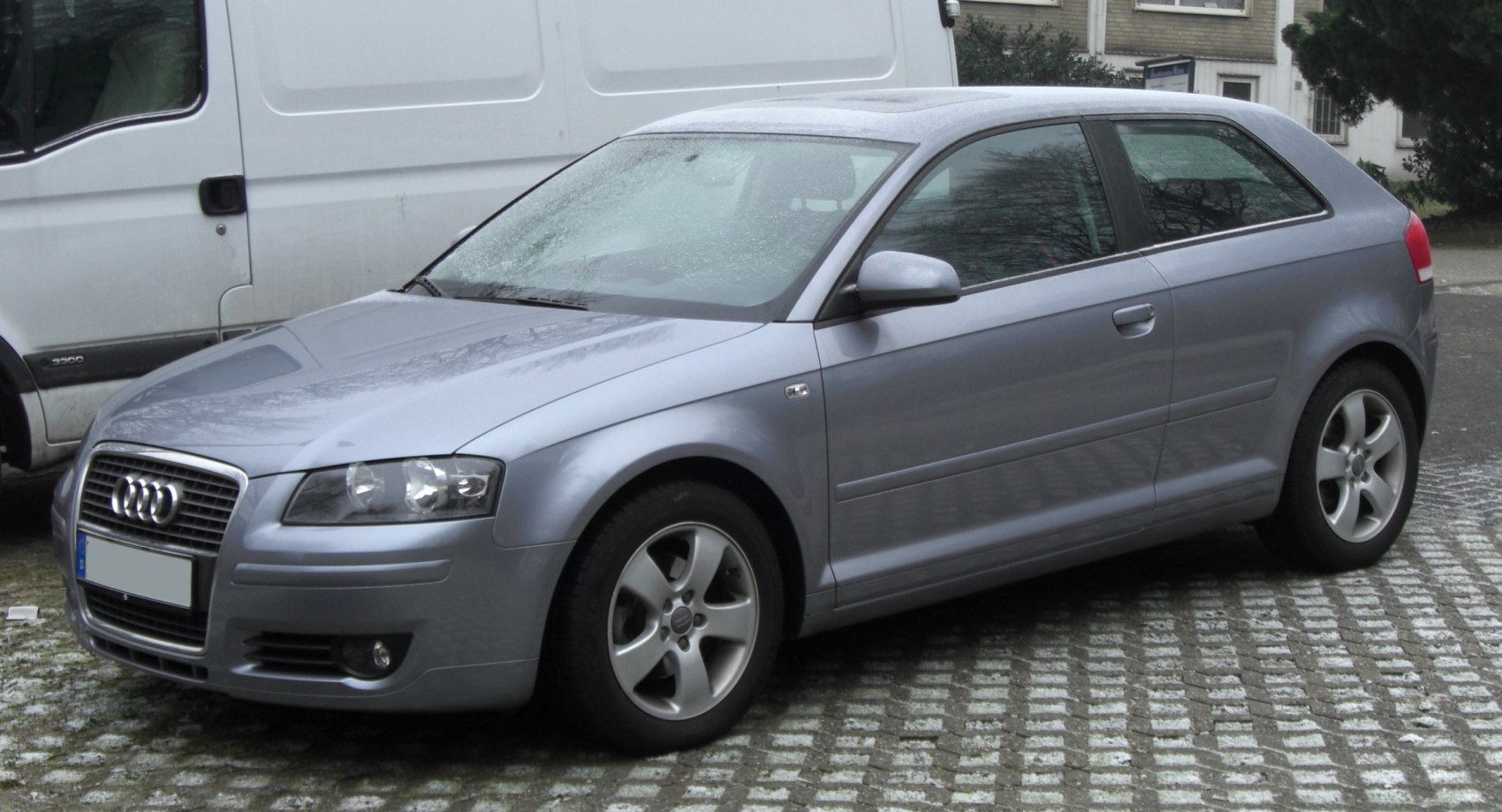 Front side view of compact hatchback with alloy wheels