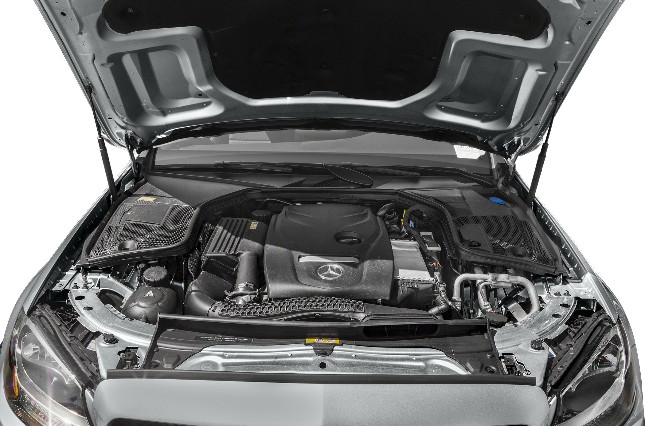 Engine compartment showing covered engine and surrounding components under open hood.