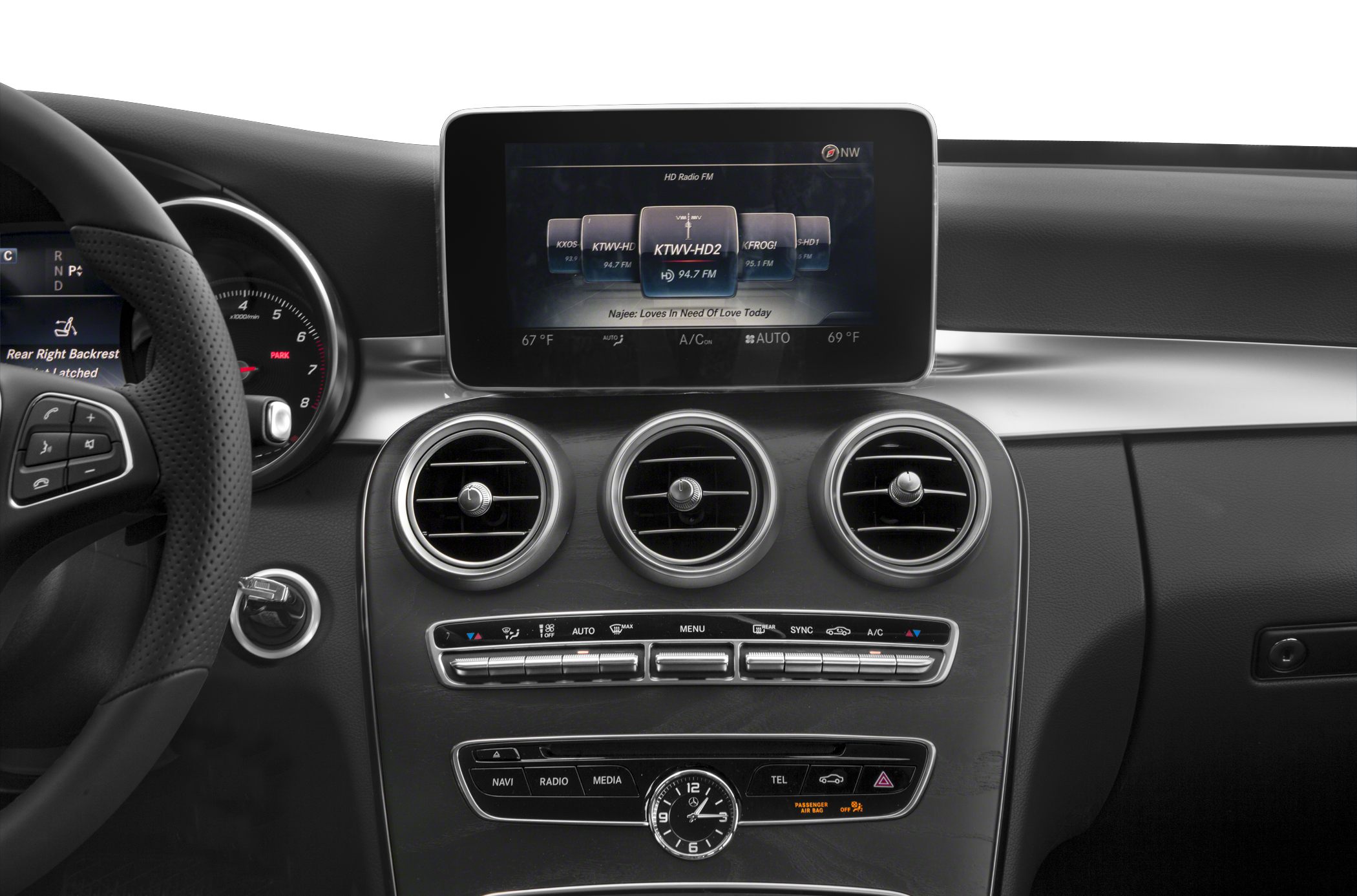 Triple circular air vents and infotainment screen on dashboard central console