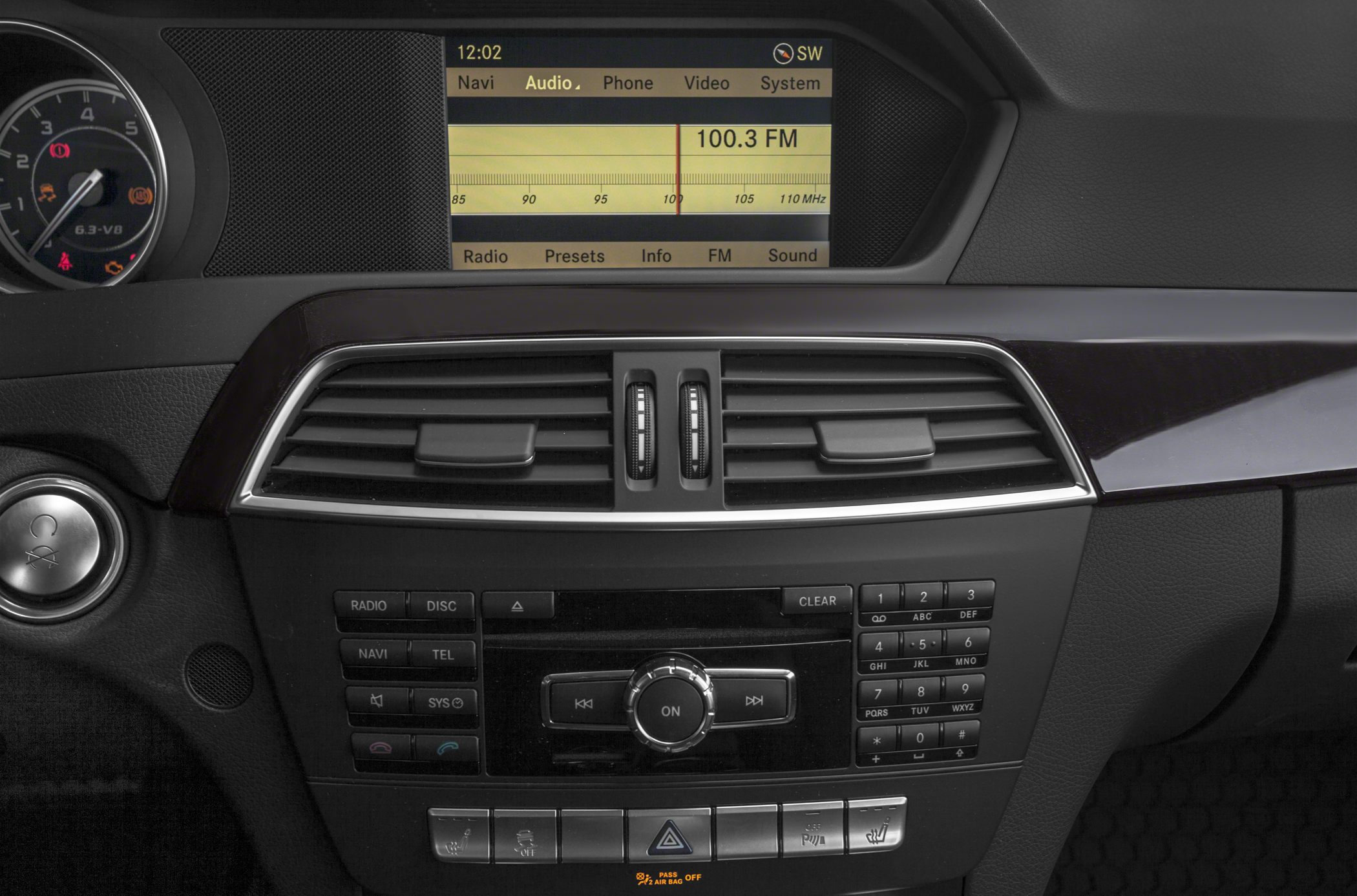 Central infotainment display, control panel, and air vents on a car dashboard