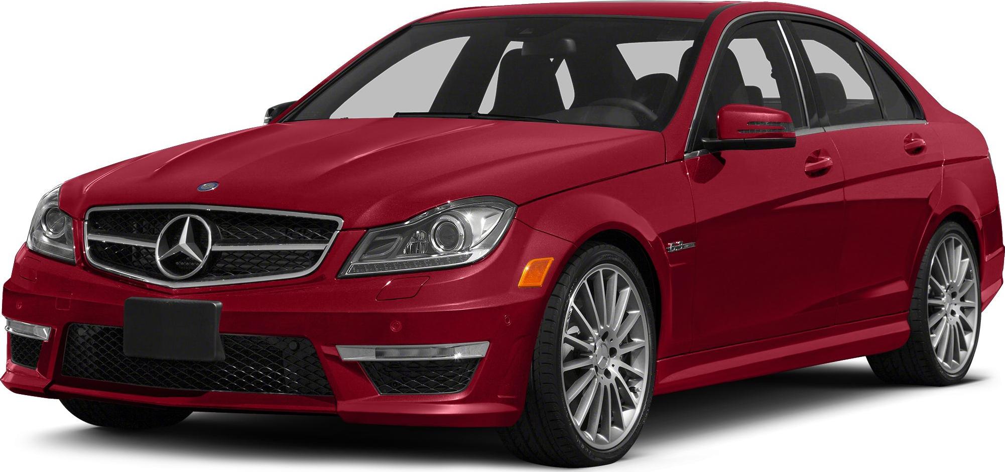 Front and side perspective of a red sedan with distinctive grille and alloy wheels