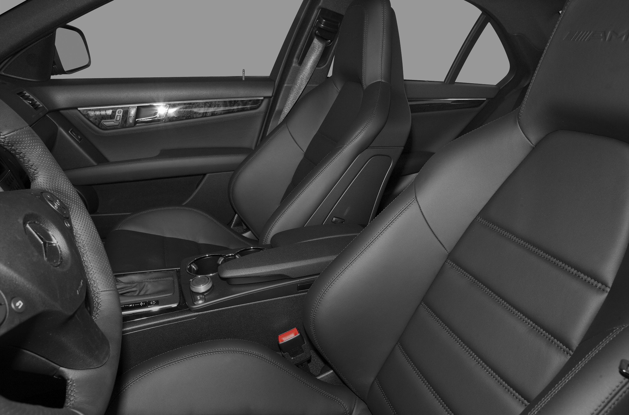 Black leather sport bucket seats with center console and AMG branding
