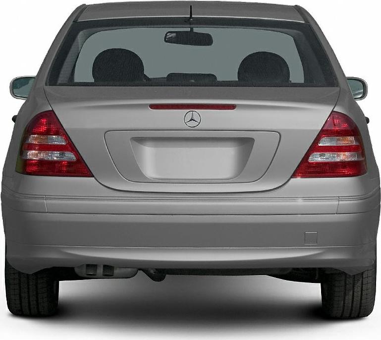Rear view of a sedan with taillights, rear windshield, and bumper