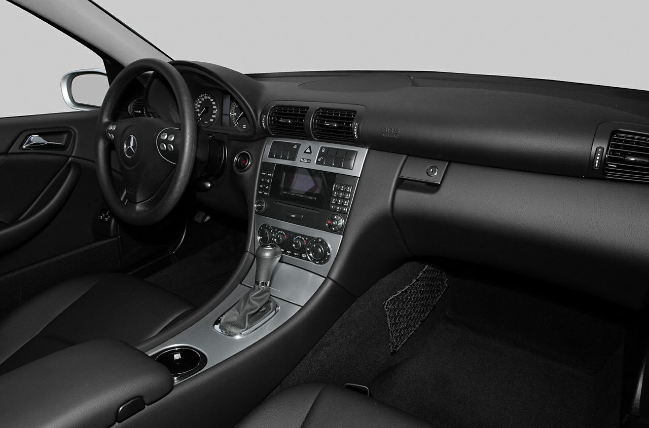 Dashboard and center console interior of a luxury coupe.