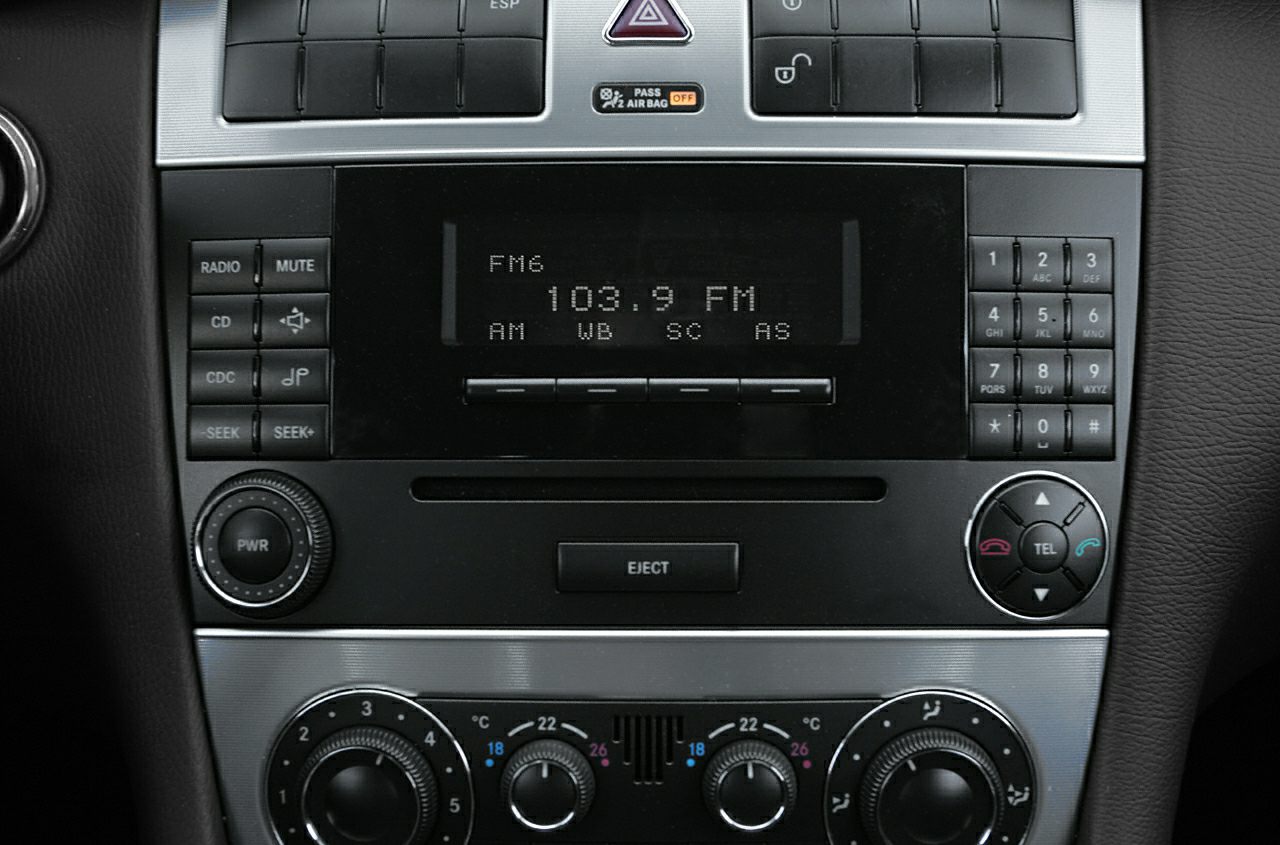 Center console with radio display and climate control knobs
