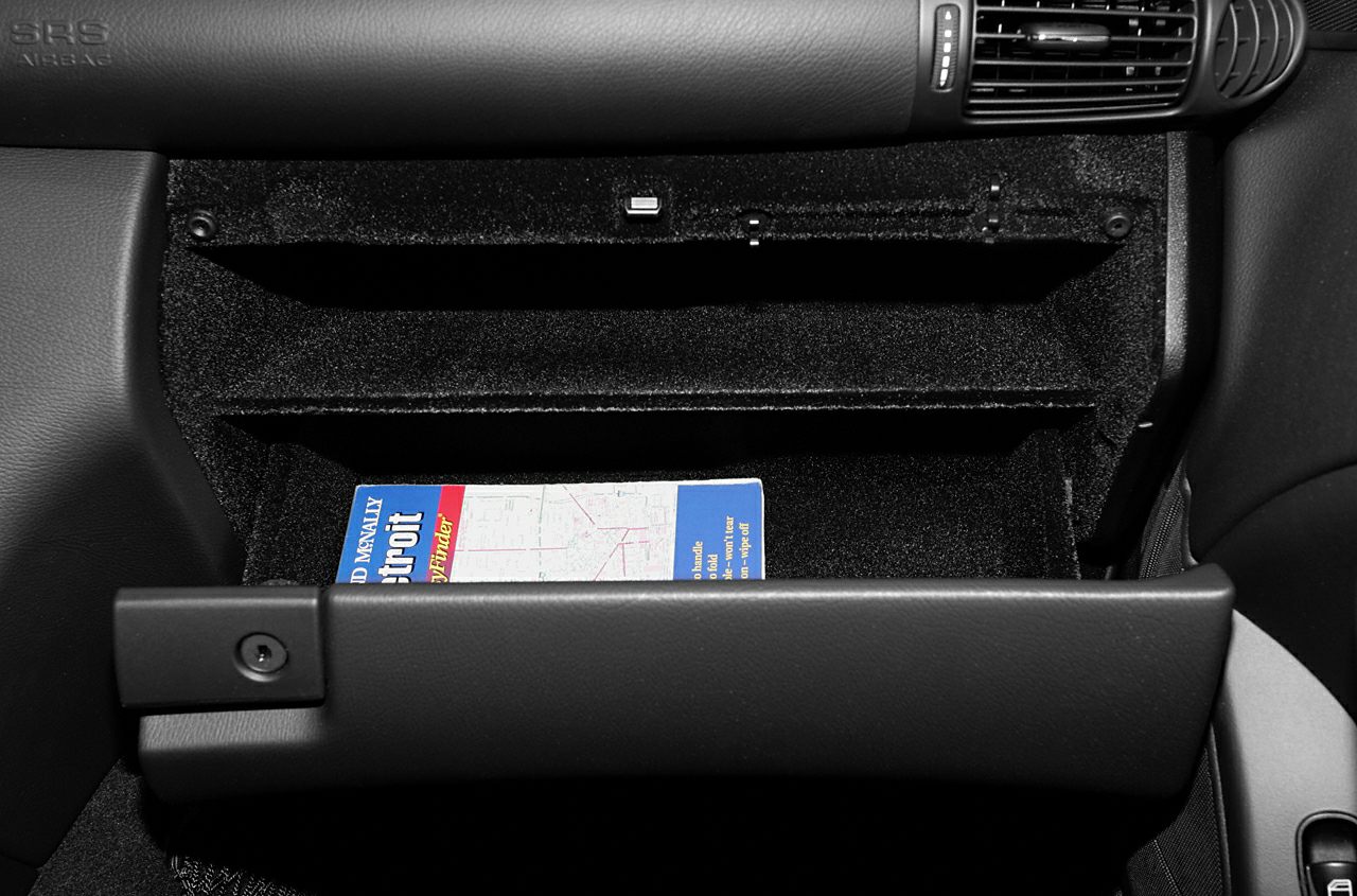 Open glove compartment with shelf and storage space