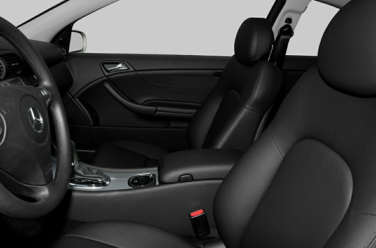 Black leather seats and steering wheel in car interior