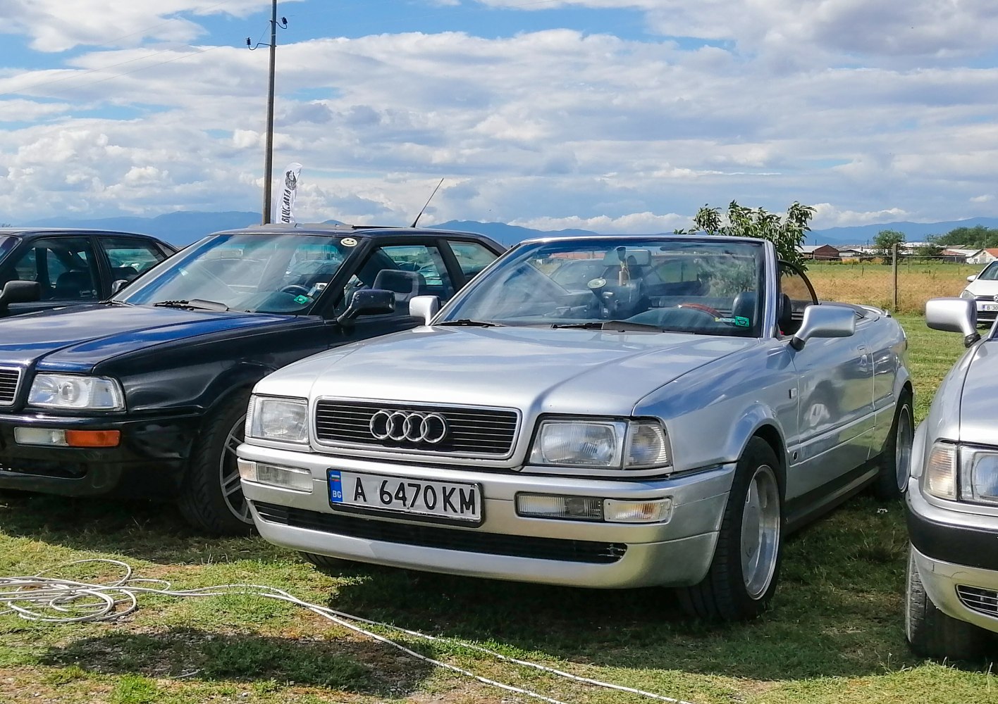 Classic convertible with prominent front grille and headlights