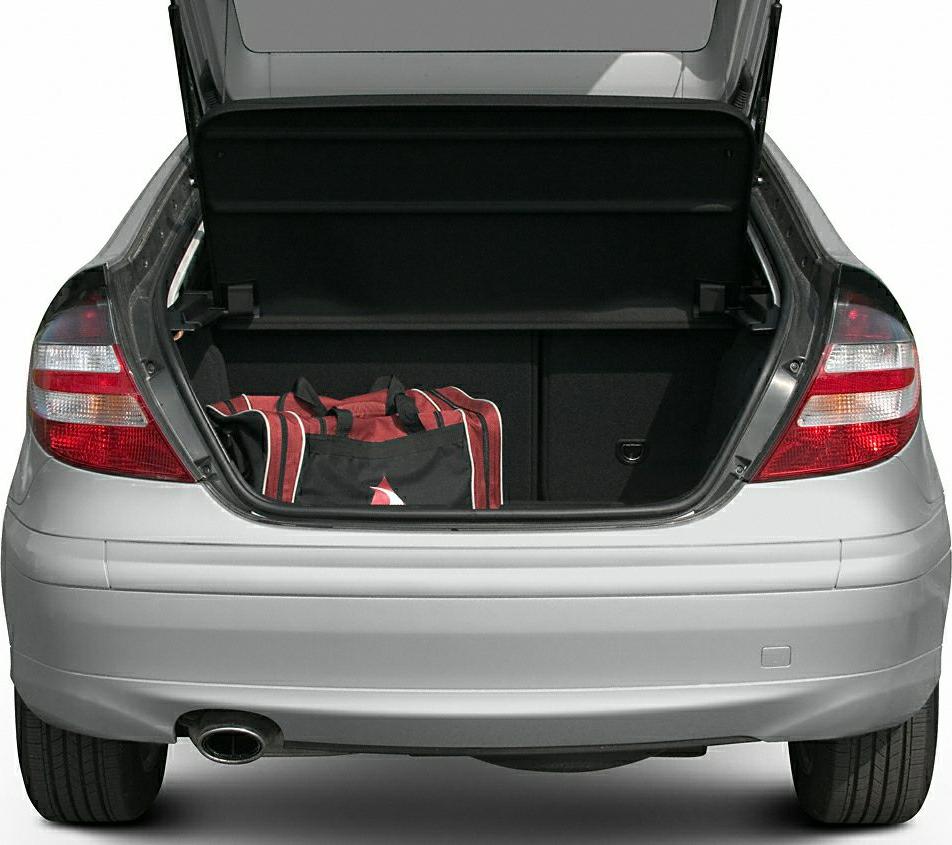 Open car trunk with visible cargo space and rear tail lights