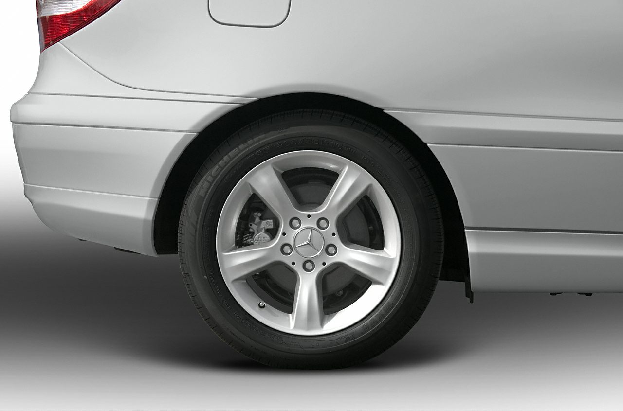 Close-up of rear alloy wheel and tire with Mercedes-Benz emblem